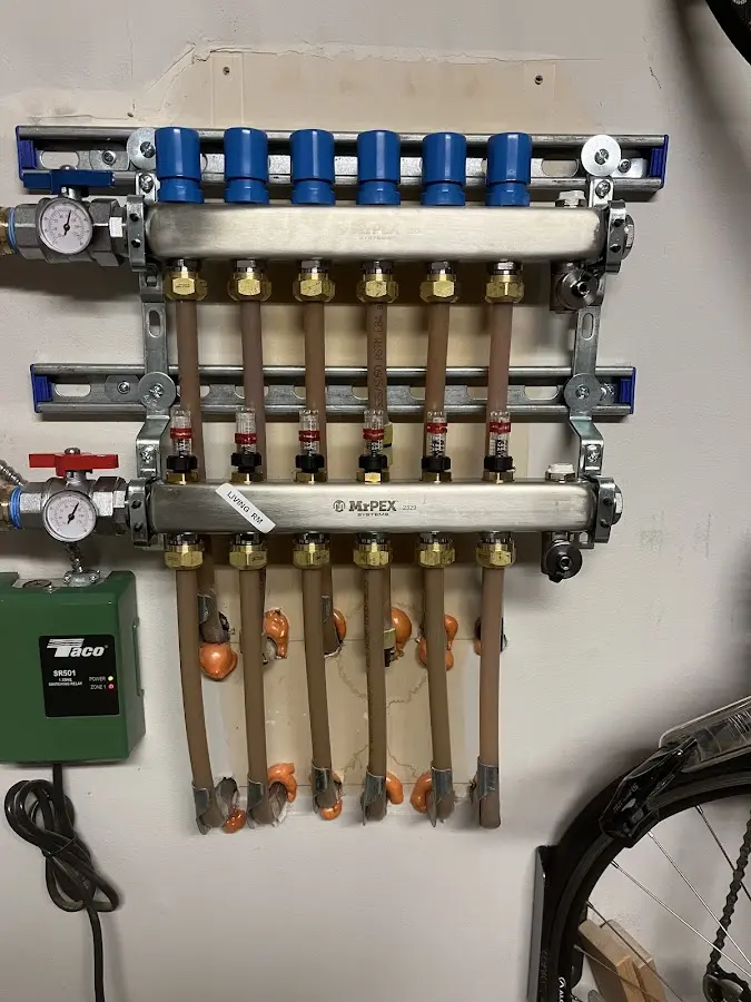 Plumber performing Water Heater Repair at a residential property in Ellisville